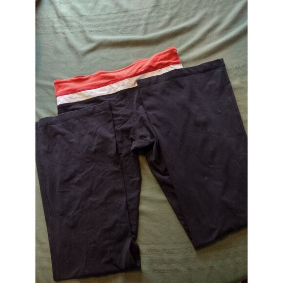 Lululemon wide leg Black leggings with and orange and white band. Size 10 - Picture 1 of 4